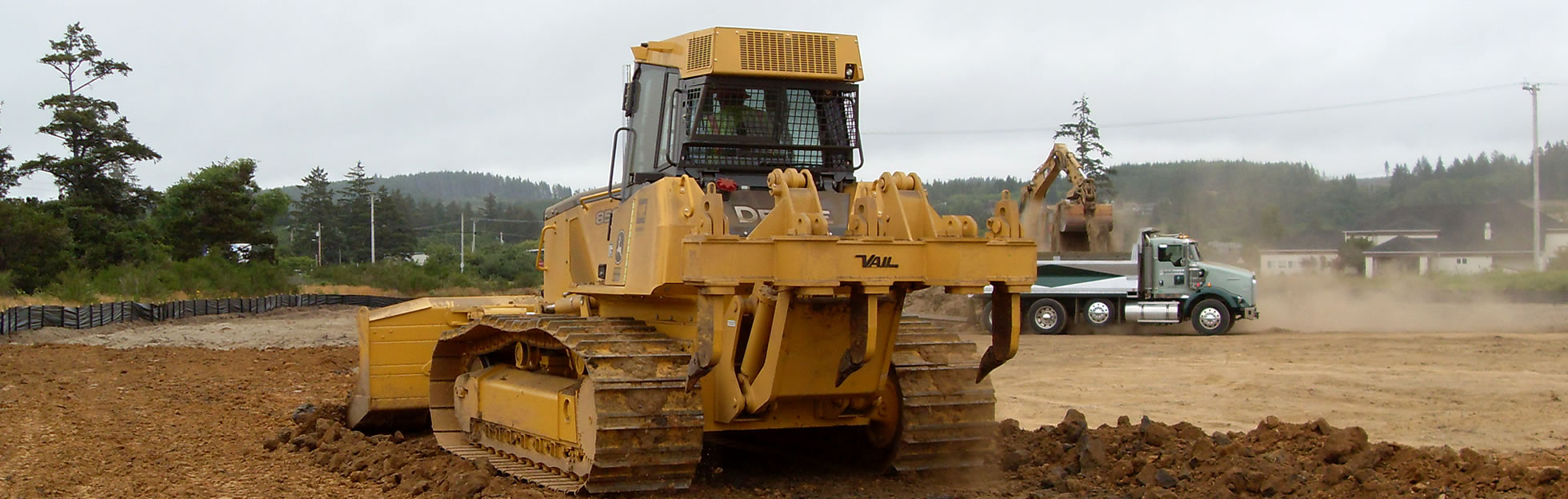 bulldozer pushing dirt on construction site
